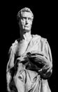 Black and white photo of stone statue of man covered with a wrinkled fabric Royalty Free Stock Photo