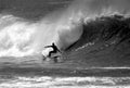 Black and White Photo of a Surfer Surfing