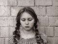 Black-and-white photo of a teenage girl with two pigtails