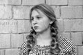 Black-and-white photo of a teenage girl with two pigtails