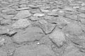 Black and white photo, texture of a stone road, background. Royalty Free Stock Photo