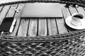 Black-and-white photo of a top view of a workspace with a laptop, on a wooden table with a smartphone a cup of coffee and a Royalty Free Stock Photo