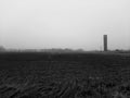 black and white photo of the tower in the field