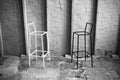 Black and white photo of two chairs facing each other in loft space. minimal concept. Royalty Free Stock Photo