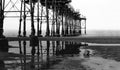 Black and white photo of Under Saltburn Pier down by the sea in Uk, High contrast in balck and white image of photo an abstract co