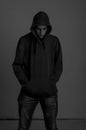 Black and white photo of upsed teenager with hoodie looking down again Royalty Free Stock Photo