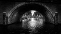 Black and White photo of View of seven historic bridges in a straight line over the Reguliersgracht in Amsterdam