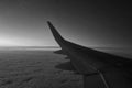 Black and white photo. View from the window of a flying plane. Royalty Free Stock Photo
