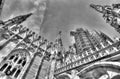 Black and white photo of the white marble statues of Cathedral Duomo di Milano on piazza Royalty Free Stock Photo