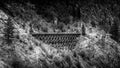 Black and White Photo of Wooden Trestle Bridge of the abandoned Kettle Valley Railway in Myra Canyon Royalty Free Stock Photo