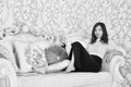 Black white photo of Young asian sexual model with long legs lying on the sofa Royalty Free Stock Photo