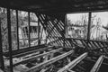 A black and white photograph of a beveled wooden construction of residential buildings