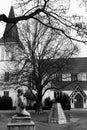 Black and White Church with Angel Sculpture and Trees