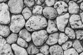 Black and white photograph of a decorative pattern of stones from the sea shore