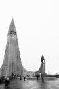Black and white photograph of the front of Hallgrimskirkja with statue of Leifur Eiriksson