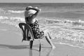 Monochrome photography. beautiful girl on a chair on the coast Royalty Free Stock Photo