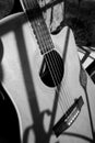 Black and white photograph of a vintage acoustic guitar