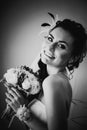 Black white photography beautiful young happy bride standing near the window Royalty Free Stock Photo