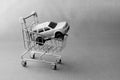 Black and white photography concept of car sales, car in a cart