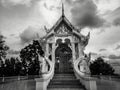 Black and white photography with little buddhist white temple with nobody and dramatic cloudy sky in dark atmosphere Royalty Free Stock Photo