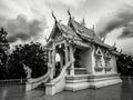 Black and white photography with little buddhist white temple with nobody and dramatic cloudy sky in dark atmosphere Royalty Free Stock Photo