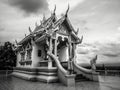 Black and white photography with little buddhist white temple with nobody and dramatic cloudy sky in dark atmosphere Royalty Free Stock Photo