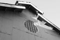 Black and white picture of Circle shape of sun ray house on the zinc wall and roof Royalty Free Stock Photo