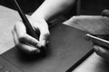 Black and white picture of man`s hand using a digital tablet and stylus pen. drawing practice, professional designer, graphic Royalty Free Stock Photo