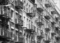 Manhattan old residential buildings with fire escapes, New York City, USA