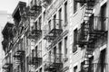 Manhattan old residential buildings with fire escapes, New York City, USA
