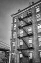 Old building with fire escape, NYC. Royalty Free Stock Photo