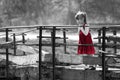 Black and white picture of pretty blond child girl in red dress Royalty Free Stock Photo