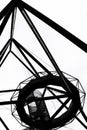 Black and white picture of the steel construction of Tetrahedron in german Bottrop taken from below against the sky