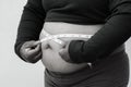 Black and white picture style for Close-up of fat woman on white background. Concept for obesity issue, diet of food for health