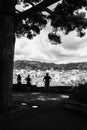 Black and white picture of tourits overlooking the city of Cannes Royalty Free Stock Photo