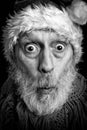 Black and white portrait of an adult man disguised in Santa Claus