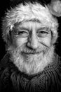 Black and white portrait of an adult man disguised in Santa Claus