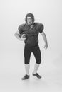 Black and white portrait of american football player in vintage style sports uniform isolated on white background Royalty Free Stock Photo