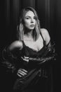 Black and white portrait of the attractive blonde woman in silk dress and black jacket Royalty Free Stock Photo