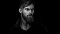 Black and white portrait of bearded handsome man in a pensive mo Royalty Free Stock Photo