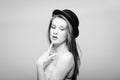 Black and white portrait of beautiful young woman in bowler hat Royalty Free Stock Photo