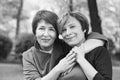 Black and white portrait of cute mature women 60s and 40s years in park Royalty Free Stock Photo