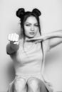 Black and white portrait of evil young brunette woman with fists. focus on hand