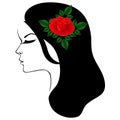 Black and white portrait of a girl in profile with a red rose in her hair. Royalty Free Stock Photo