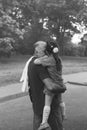 Black and white portrait of Happy granddad and grandaughter hugging at the park