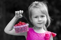 Black and white portrait of a little girl child holdind small ba Royalty Free Stock Photo