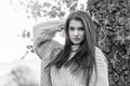 Black and white portrait of long haired young woman posing outdoors Royalty Free Stock Photo