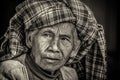 Black and white portrait of an old indigenous woman in Myanmar