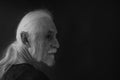 Black and white portrait of old man looking over his shoulder Royalty Free Stock Photo