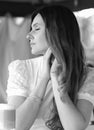 Black and white portrait in profile of a beautiful girl in a white T-shirt Royalty Free Stock Photo